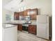 Modern kitchen featuring granite countertops, stainless steel appliances, dark wood cabinets, and recessed lighting at 915 Terance Ave, Jonesboro, GA 30238