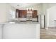 Modern kitchen with dark wood cabinets, granite countertops, stainless steel appliances, and recessed lighting at 915 Terance Ave, Jonesboro, GA 30238