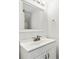 Clean bathroom features a single sink vanity with a square mirror, a chrome faucet, and a towel ring at 2261 Wellington Cir, Lithonia, GA 30058