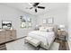 Bedroom features wood-look flooring, ceiling fan, one window, and neutral decor at 2261 Wellington Cir, Lithonia, GA 30058