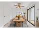 Staged dining room featuring a wooden table with seating for six and a sliding glass door to outside at 2261 Wellington Cir, Lithonia, GA 30058