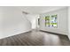 Bright living room features fresh paint, hardwood floors, and large windows offering natural light at 2261 Wellington Cir, Lithonia, GA 30058