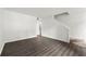 Spacious living room features fresh paint, hardwood floors, and staircase for easy access to other rooms at 2261 Wellington Cir, Lithonia, GA 30058