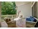 Inviting back porch with comfortable seating and outdoor charm, perfect for relaxing and entertaining at 3380 Canon Bay Dr, Cumming, GA 30041