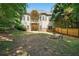 Large multi-tiered backyard features a fire pit at 3380 Canon Bay Dr, Cumming, GA 30041