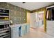Charming closet with natural light, designer wallpaper, and custom storage solutions at 3380 Canon Bay Dr, Cumming, GA 30041