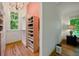 Charming closet with natural light, a chandelier, and custom storage solutions at 3380 Canon Bay Dr, Cumming, GA 30041