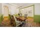 Open-concept dining room featuring brick floors, wainscoting, and decorative chandelier at 3380 Canon Bay Dr, Cumming, GA 30041