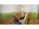 Dining room with brick floors, wainscoting, chandelier, and a wooden table with upholstered chairs at 3380 Canon Bay Dr, Cumming, GA 30041