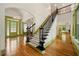 Spacious foyer with high ceilings, decorative lighting, staircase, and hardwood floors at 3380 Canon Bay Dr, Cumming, GA 30041