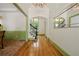 Elegant foyer with hardwood floors, decorative wainscoting, chandelier, and staircase at 3380 Canon Bay Dr, Cumming, GA 30041
