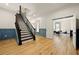 Hallway featuring hardwood floors, crown molding, and staircase at 3380 Canon Bay Dr, Cumming, GA 30041