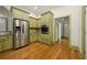 Well-appointed kitchen offers stainless steel appliances, ample cabinetry, and stylish flooring at 3380 Canon Bay Dr, Cumming, GA 30041