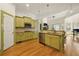 Open-concept kitchen features stainless appliances, ample counter space, and seamless access to living areas at 3380 Canon Bay Dr, Cumming, GA 30041