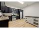 Kitchen with stainless steel appliances, granite countertops, and stylish black cabinetry at 3380 Canon Bay Dr, Cumming, GA 30041