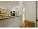 Open concept kitchen with granite countertops, stainless steel appliances, and view into living area at 3380 Canon Bay Dr, Cumming, GA 30041