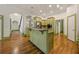 Beautiful kitchen with green cabinets, granite countertops, stainless steel appliances, and a decorative island at 3380 Canon Bay Dr, Cumming, GA 30041