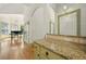 Kitchen showcasing granite countertops and seamless transition to the bright and open living area at 3380 Canon Bay Dr, Cumming, GA 30041