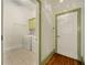 Bright laundry room boasts tile floors, white appliances, and shelving, conveniently located near an entryway at 3380 Canon Bay Dr, Cumming, GA 30041