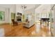 Bright living room boasts a fireplace, high ceilings, built-in shelves and windows providing ample natural light at 3380 Canon Bay Dr, Cumming, GA 30041