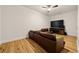 Comfortable living room with hardwood floors and a large sectional sofa at 3380 Canon Bay Dr, Cumming, GA 30041