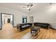 Bright living room featuring hardwood floors and designer sofas at 3380 Canon Bay Dr, Cumming, GA 30041
