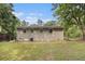 Large backyard featuring a brick home exterior and lush greenery at 442 Cologne Se Dr, Atlanta, GA 30354