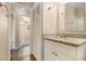 Bathroom featuring a granite countertop vanity, white cabinets, and a view to the shower at 442 Cologne Se Dr, Atlanta, GA 30354