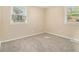 Bright bedroom featuring new neutral carpet and two windows for great natural lighting at 442 Cologne Se Dr, Atlanta, GA 30354
