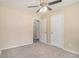 Spacious bedroom with carpet, ceiling fan and a view of the bedroom doors at 442 Cologne Se Dr, Atlanta, GA 30354