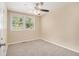 Cozy bedroom with plush neutral carpet, ceiling fan, and serene natural light at 442 Cologne Se Dr, Atlanta, GA 30354