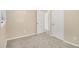 Comfortable bedroom with plush carpeting, a window and two doors at 442 Cologne Se Dr, Atlanta, GA 30354