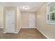 Inviting foyer with beautiful wood-look flooring and ample natural light from the front door window at 442 Cologne Se Dr, Atlanta, GA 30354