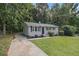 Quaint single-story home with a classic design, complemented by a lush green lawn at 442 Cologne Se Dr, Atlanta, GA 30354