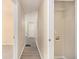 Hallway showcasing wood-look floors, laundry closet and access to other rooms at 442 Cologne Se Dr, Atlanta, GA 30354