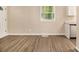 Bright living room featuring wood-look floors and a window with natural light at 442 Cologne Se Dr, Atlanta, GA 30354