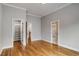 Spacious bedroom with hardwood floors, neutral walls, and access to closets and hallways at 1271 Fenway Cir, Decatur, GA 30030