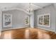 Inviting bedroom features hardwood floors, neutral walls, and three windows for ample light at 1271 Fenway Cir, Decatur, GA 30030