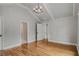 Bright bedroom with vaulted ceiling, chandelier, and access to closet at 1271 Fenway Cir, Decatur, GA 30030