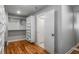 Walk-in closet with custom shelving and racks for optimal organization at 1271 Fenway Cir, Decatur, GA 30030