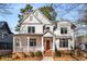 Inviting two-story home featuring a brick front porch and classic white siding at 1271 Fenway Cir, Decatur, GA 30030