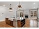 Gourmet kitchen features island, stainless appliances, and fireplace at 1271 Fenway Cir, Decatur, GA 30030