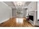 Bright living room with fireplace, built-in shelves, and hardwood floors at 1271 Fenway Cir, Decatur, GA 30030