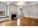 Spacious living room features hardwood floors, fireplace, built-in shelves, and large windows at 1271 Fenway Cir, Decatur, GA 30030