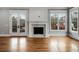 Living room features hardwood floors, fireplace, and large windows at 1271 Fenway Cir, Decatur, GA 30030
