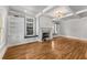 Bright living room with hardwood floors, built-in shelves, fireplace, and coffered ceiling at 1271 Fenway Cir, Decatur, GA 30030