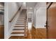Elegant staircase featuring hardwood steps and floors, with a view of a hallway at 1271 Fenway Cir, Decatur, GA 30030