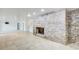 Finished basement featuring a brick fireplace, tile floors, and ample space for living or recreation at 1676 Moores Mill Nw Rd, Atlanta, GA 30327