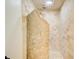 Luxurious shower showcasing neutral tile and unique stonework, offering a spa-like experience at 1676 Moores Mill Nw Rd, Atlanta, GA 30327