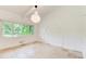 Bright bedroom features tile floors, a large window, and ample natural light at 1676 Moores Mill Nw Rd, Atlanta, GA 30327
